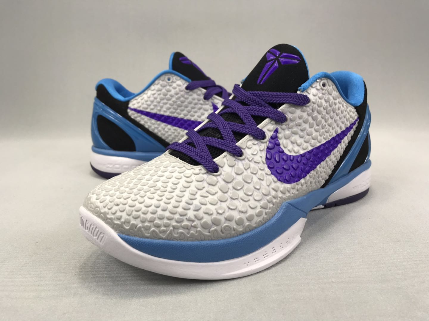 kobe bryant white and purple shoes